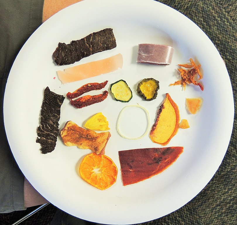 Photo of various dried food on a white plate